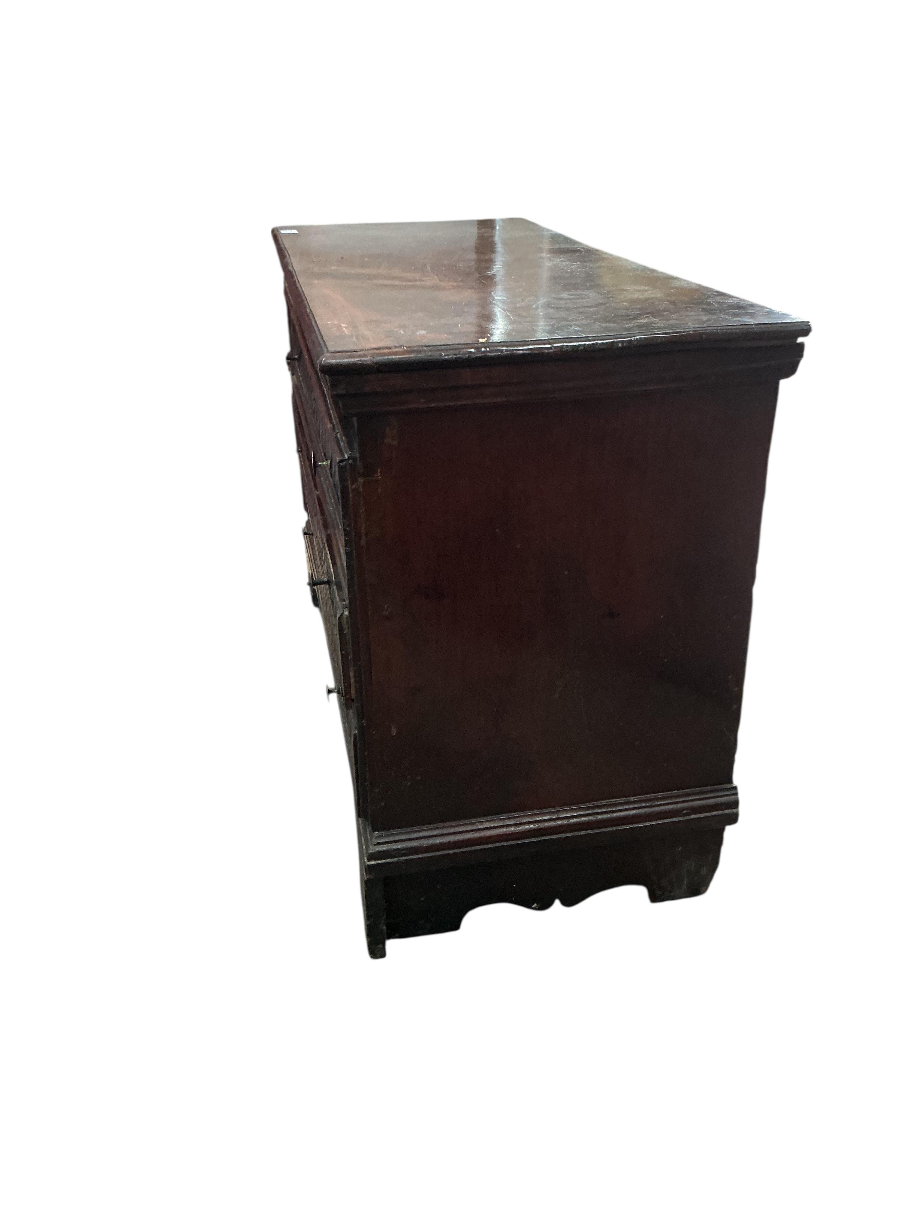 An 18th century Continental carved walnut chest, width 131cm, depth 56cm, height 88cm